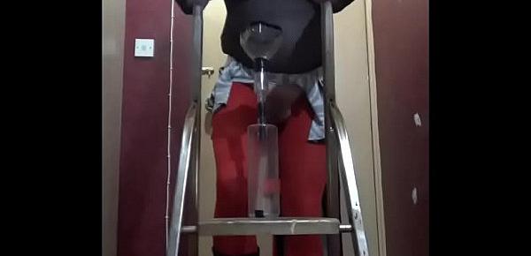  crossdressing sissy pissing in a bottle from on a ladder drinks the lot